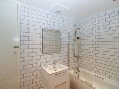 A bathroom with a bathtub and sink at 58A South Ford Road Dartmouth
