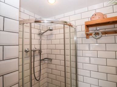 A shower with glass door and tiles at 58A South Ford Road Dartmouth