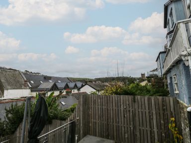 A view of houses and a garden with a fence at 58A South Ford Road Dartmouth