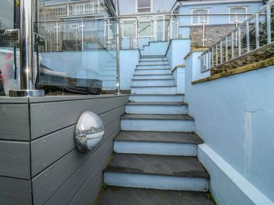 A staircase leading to an entrance at 58A South Ford Road Dartmouth