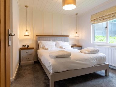 A bedroom with a double bed and bedside furniture at Wensleydale Aysgarth