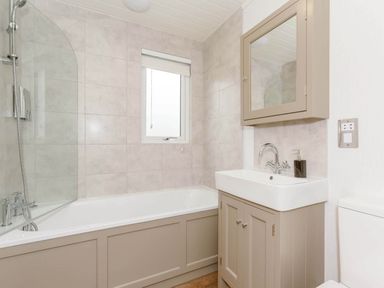 A bathroom with a bathtub, sink, and shower at Wensleydale Aysgarth