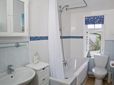 A bathroom with a bathtub and shower at St Leonards in Salcombe
