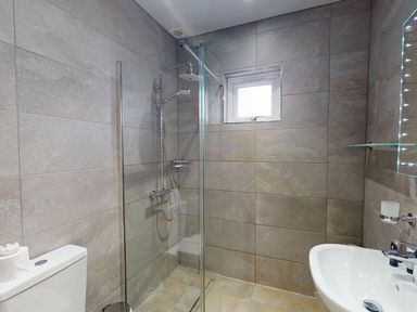 A bathroom with a shower and sink at Summerleaze Cottage 2 Spa Bude