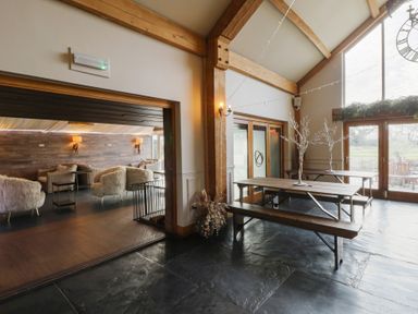 A dining room with a table and chairs at The Family Pod Swansea
