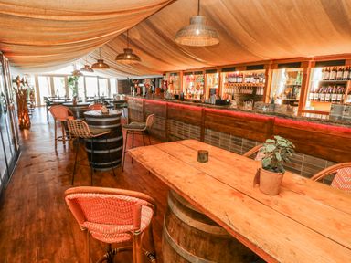 A bar area with tables and a counter at Glamping Pod 1 Oldwalls, Llanrhidian, Gower
