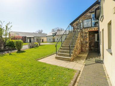 An outdoor area with stairs and buildings at Glamping Pod 1, Oldwalls, Llanrhidian, Gower