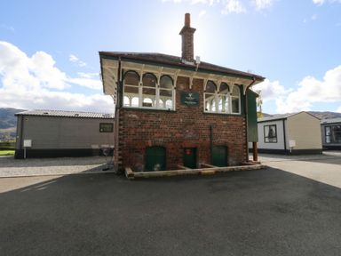 A building with windows and a chimney at Altair Lodge