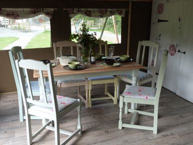 A dining room with table and chairs at Ceri in Newcastle Emlyn