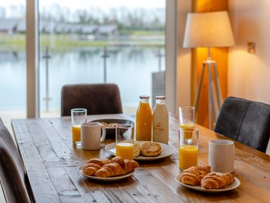 A dining room table with breakfast items at Tranquillity 3 in Warton near Carnforth