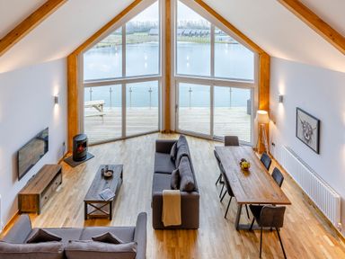 A living room with a sofa and dining table at Tranquillity 3 Warton near Carnforth