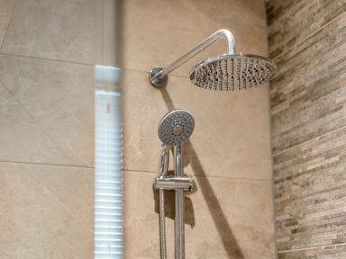 A shower area with a shower head and handheld shower at Tranquillity 3 in Warton near Carnforth