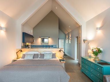 A bedroom with a bed and cabinets at The Weir in North Berwick