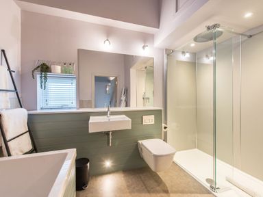 A bathroom with a bathtub, sink, toilet, and shower at The Weir in North Berwick