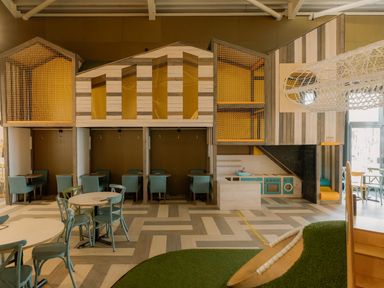 A playroom with play structures and seating at The Weir in North Berwick