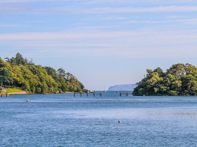 A view of water with trees and a pier at New build at Tyn Pwll in Llanfairpwllgwyngyll