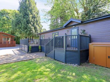 A cabin with a deck and steps at Evermore Lodge 48 Calgarth Park, White Cross Bay, Windermere