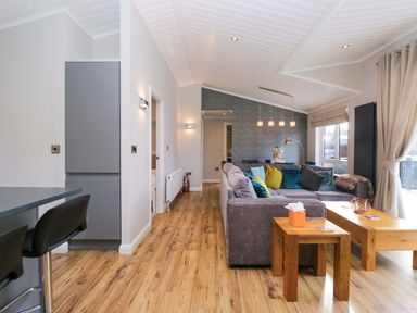 A living room with a sofa and coffee table at 7 Lake View, Lake View 7, White Cross Bay near Windermere