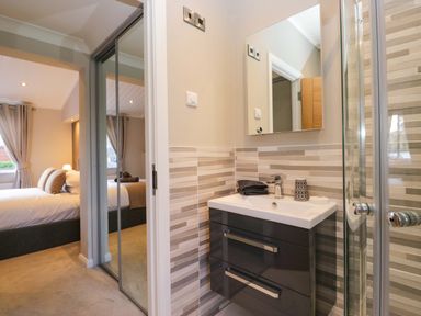 A bathroom with a sink and shower at 7 Lake View, Lake View 7, White Cross Bay near Windermere
