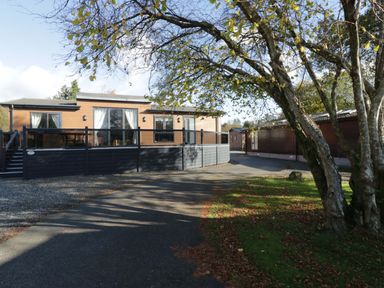 A house with a deck and windows at 7 Lake View, Lake View 7, White Cross Bay near Windermere
