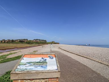 A sign and pathway at Otter Estuary Nature Reserve in Colaton Raleigh