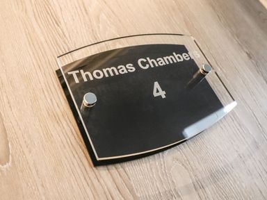 A sign displaying Thomas Chambers and room number 4 at Thomas Chambers in Camborne