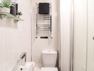 A bathroom with a sink and toilet at Teylu in Camborne