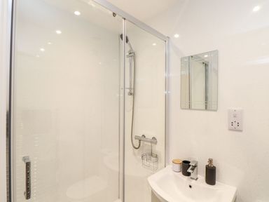 A bathroom with a shower and sink at Battell Chambers in Camborne