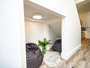 A snug area with bean bags and a plant at Daniel Chambers in Camborne