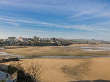 A beach view with houses on the shore at Gilfach Goed in Abersoch