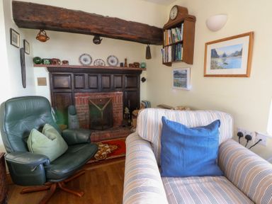 A living room with furniture and decorative items at Bryncyn in Newport, Pembrokeshire