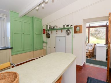 A kitchen with cabinets and countertop at Bryncyn in Newport, Pembrokeshire