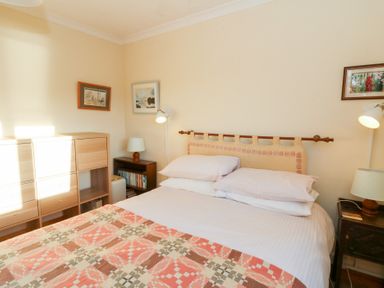 A bedroom with a bed and furniture at Bryncyn, Newport, Pembrokeshire