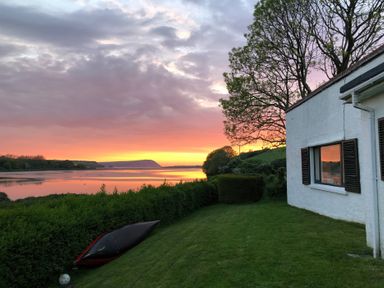 A house with a kayak by the river at Bryncyn in Newport, Pembrokeshire