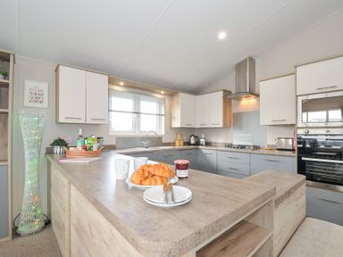A kitchen with a countertop and various appliances at 2 Summerleaze in Bude