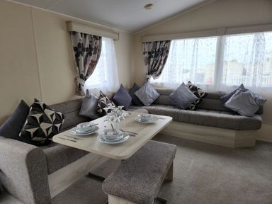 A dining area with a sofa and table set at 123 Elms