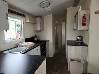 A kitchen with sink and oven at 123 Elms in 