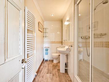 A bathroom with shower and sink at The Old Farm House near Pelynt