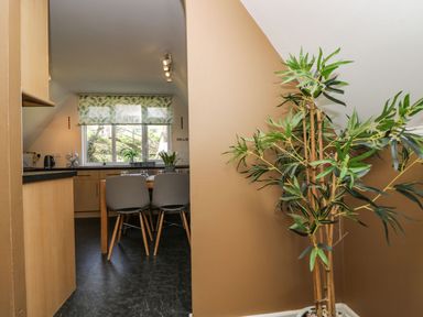 A kitchen with a table and chairs at Valley Lodge 61 Callington