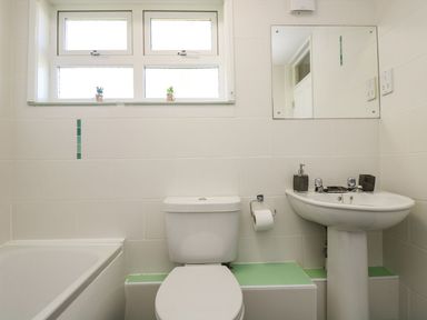 A bathroom with a sink and bathtub at Valley Lodge 61 Callington