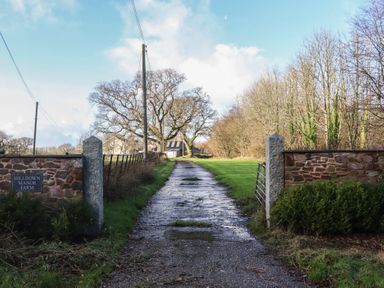A pathway leading to Hilldown Manor Farm near Bow