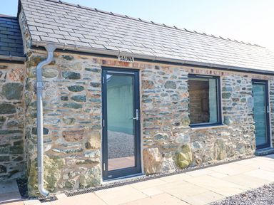A sauna with a stone exterior at Hen Penmynydd near Llanfachraeth