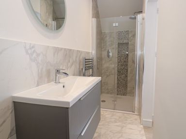 A bathroom with sink and shower at Shearwater in Praa Sands