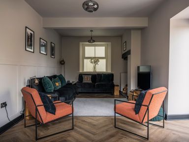 A living room with furniture and a window at Green Bank in Betws-Y-Coed