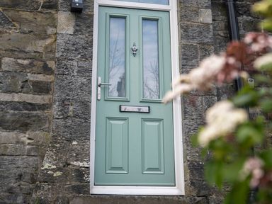 A door with a knocker and mail slot at Green Bank in Betws-Y-Coed