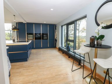 A kitchen with cabinets and a countertop at Chapel Hill in Catlowdy