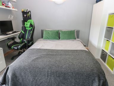 A bedroom with a bed and desk at Chapel Hill Catlowdy