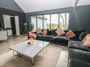 A living room with a sofa and coffee table at Chapel Hill Catlowdy