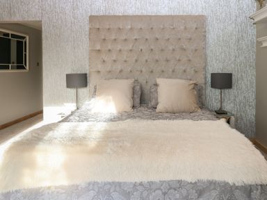 A bedroom with a bed and bedside tables at Chapel Hill in Catlowdy