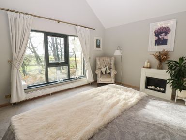A bedroom with a window and bed at Chapel Hill in Catlowdy